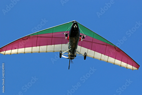 Canvas-taulu Ultralight airplane flying in a blue sky
