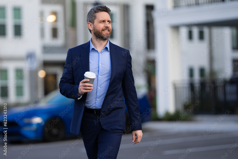 Outdoor portrait business man in classic suit. Fashionable man in suit walking outdoors. Businessman in fashion suit walking in city. Business fashion street style. Elegant man in trendy suit. Outdoor portrait business man in classic suit. Fashionable man in suit walking outdoors. Businessman in fashion suit walking in city. Business fashion street style. Elegant man in trendy suit.