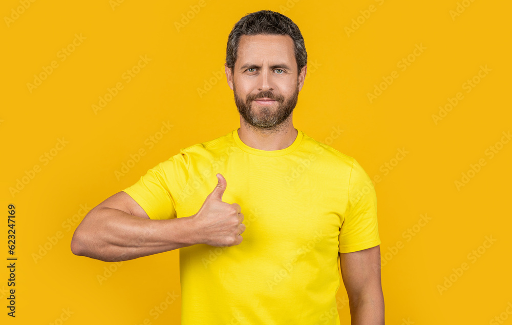 cheerful man approve on background. man approve in studio. photo of man approve with thumb up. cheerful man approve on background. man approve in studio. photo of man approve with thumb up.