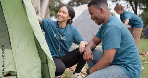Camp, tent and people high five for teamwork and support outdoor on camping trip. A man and woman counselor together for help, team building and fun adventure in nature for summer trip success