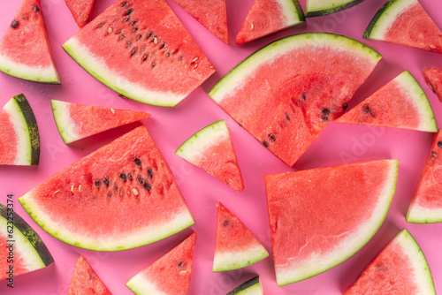Sliced watermelons on pink background
