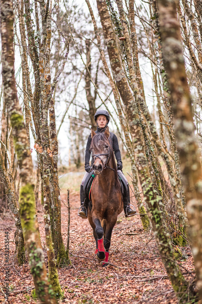 Horse riding, Way of st James in Fragas do Eume, Galicia. Hispanic woman pilgrim equitation Horse riding, Way of st James in Fragas do Eume, Galicia. Hispanic woman pilgrim equitation