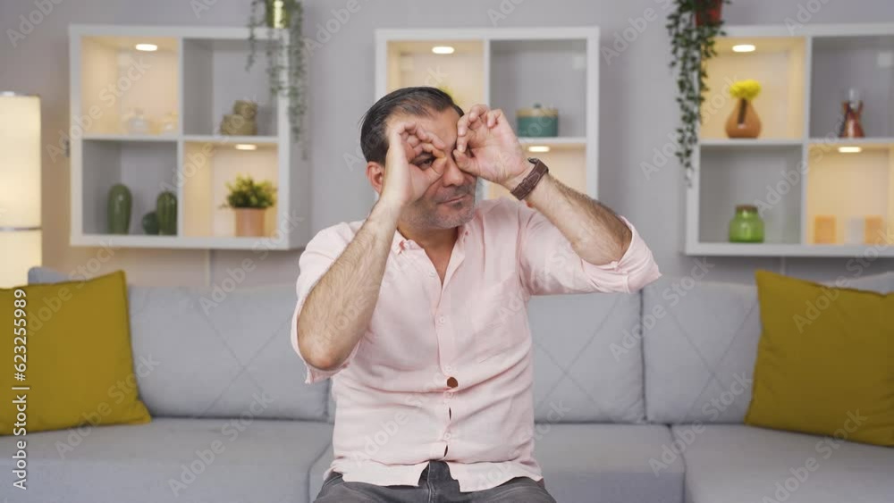 Man with binoculars looking away. Man with binoculars looking away.