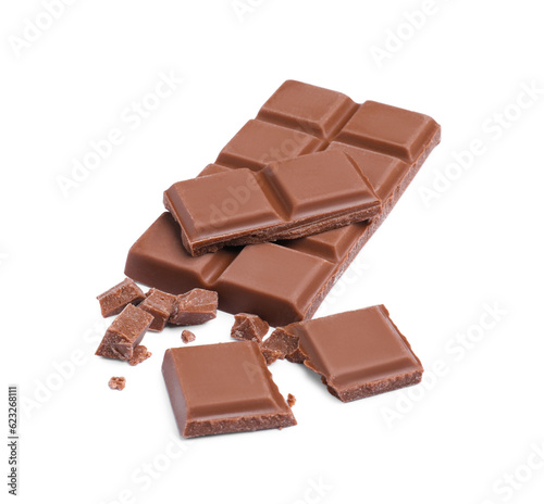 Pieces of delicious milk chocolate bar on white background