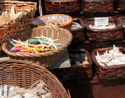 Basket brightly coloured dry starfish for sale © Brian Scantlebury