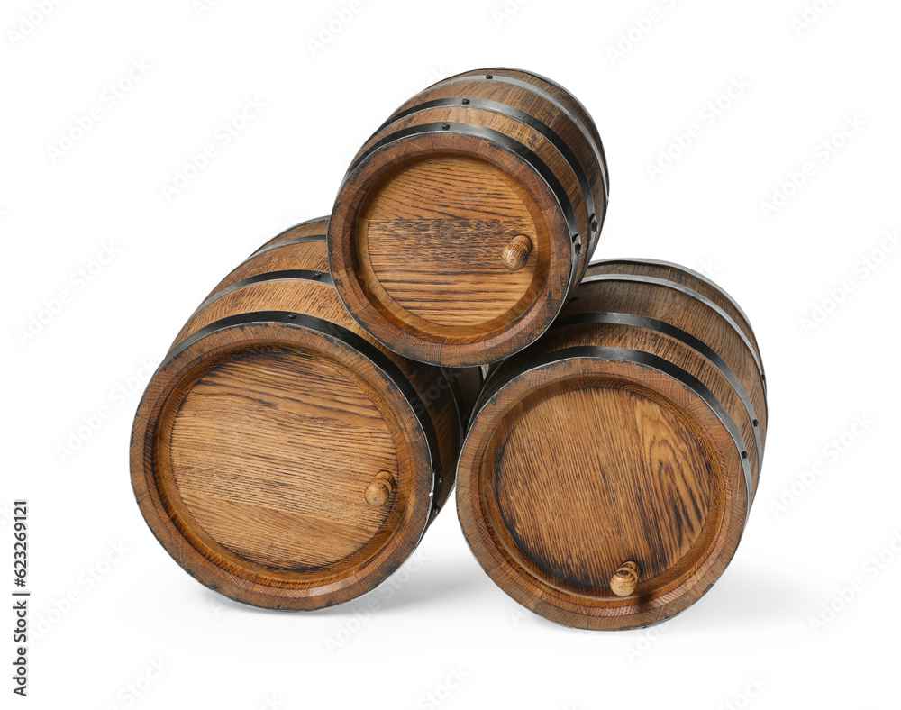 Three traditional wooden barrels on white background Three traditional wooden barrels on white background