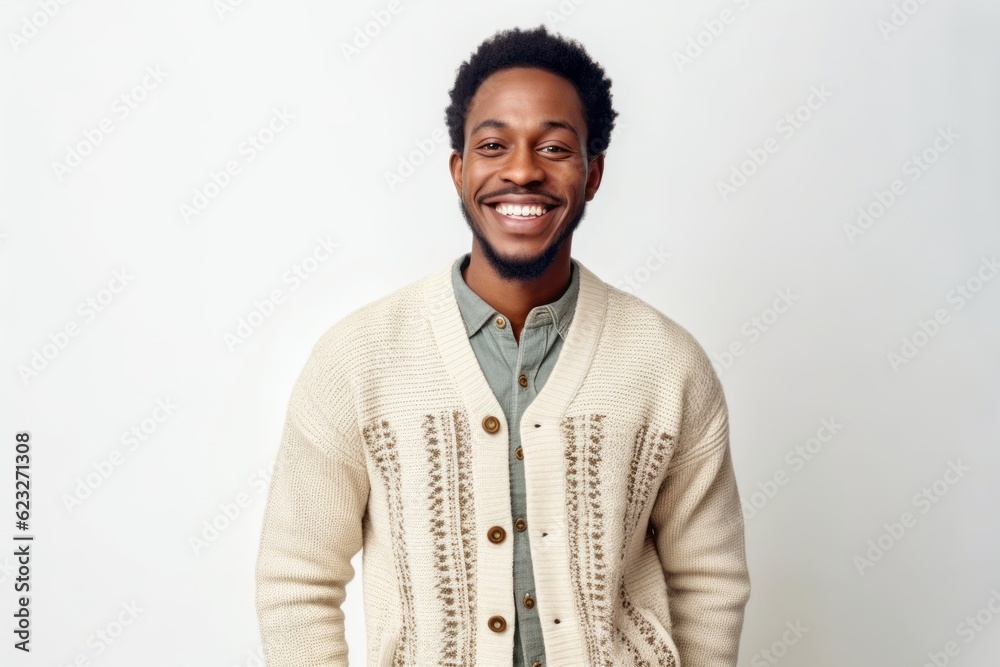 Portrait of a young african american man smiling against white background Portrait of a young african american man smiling against white background
