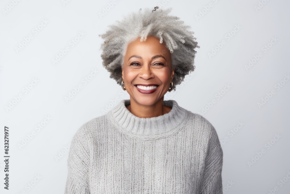 Portrait of a beautiful african american woman smiling at camera isolated on a white background Portrait of a beautiful african american woman smiling at camera isolated on a white background