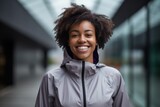 Portrait of smiling african american woman in sportswear outdoors