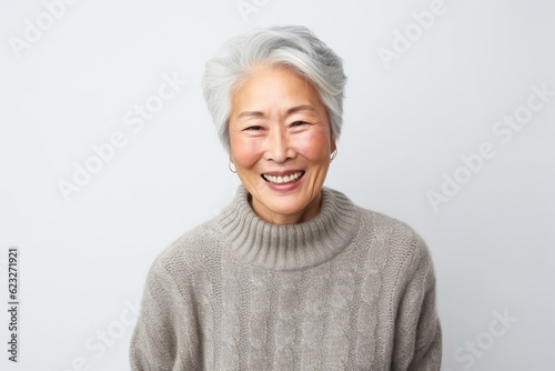 Portrait of senior asian woman smiling and looking at camera.