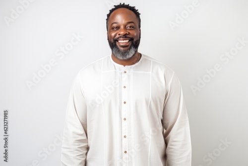 Handsome african american man in white shirt smiling at camera