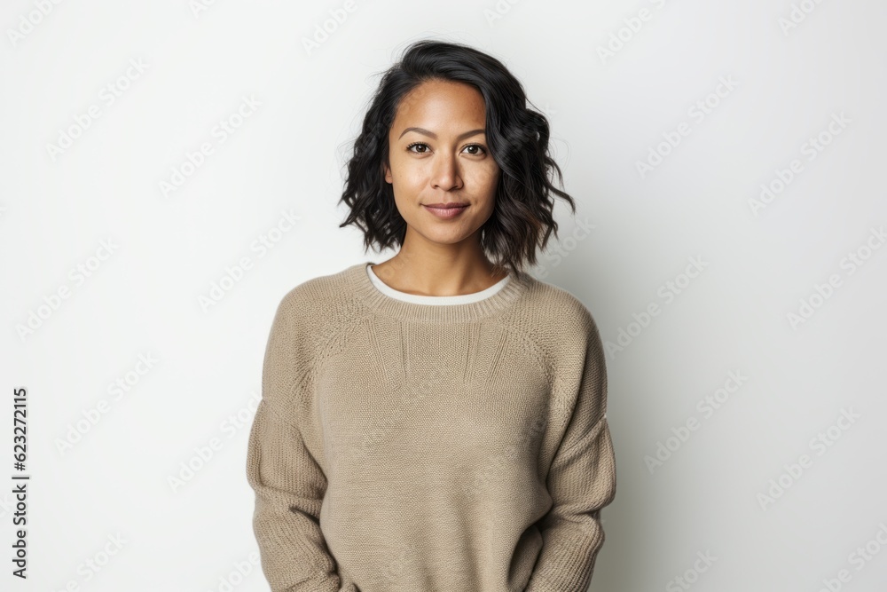 Portrait of a beautiful young woman in a sweater on a white background Portrait of a beautiful young woman in a sweater on a white background