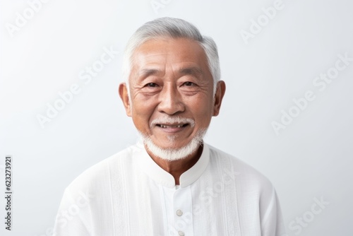 Portrait of an old asian man with white hair on white background