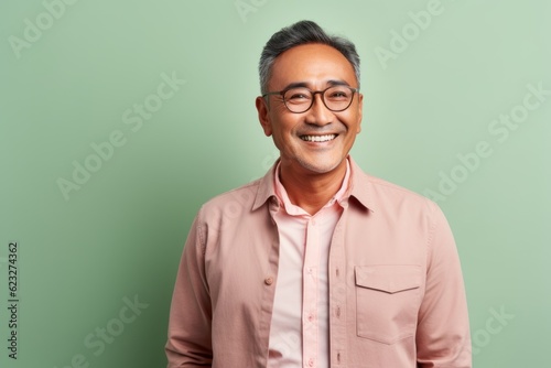 Portrait of a smiling asian senior man wearing eyeglasses