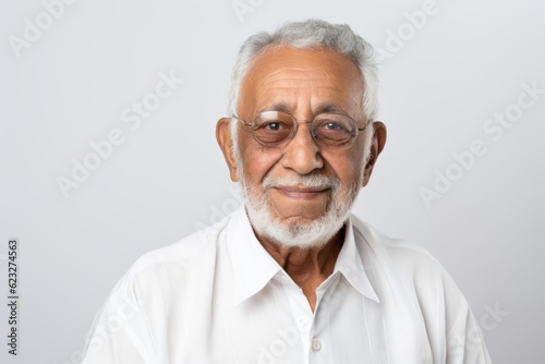 Portrait of a senior asian man wearing glasses and white shirt