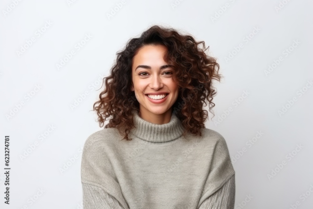 Portrait of a beautiful young woman with curly hair smiling over white background Portrait of a beautiful young woman with curly hair smiling over white background