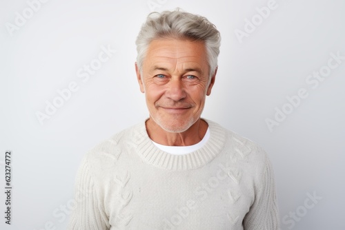 Portrait of a senior man with grey hair on a white background
