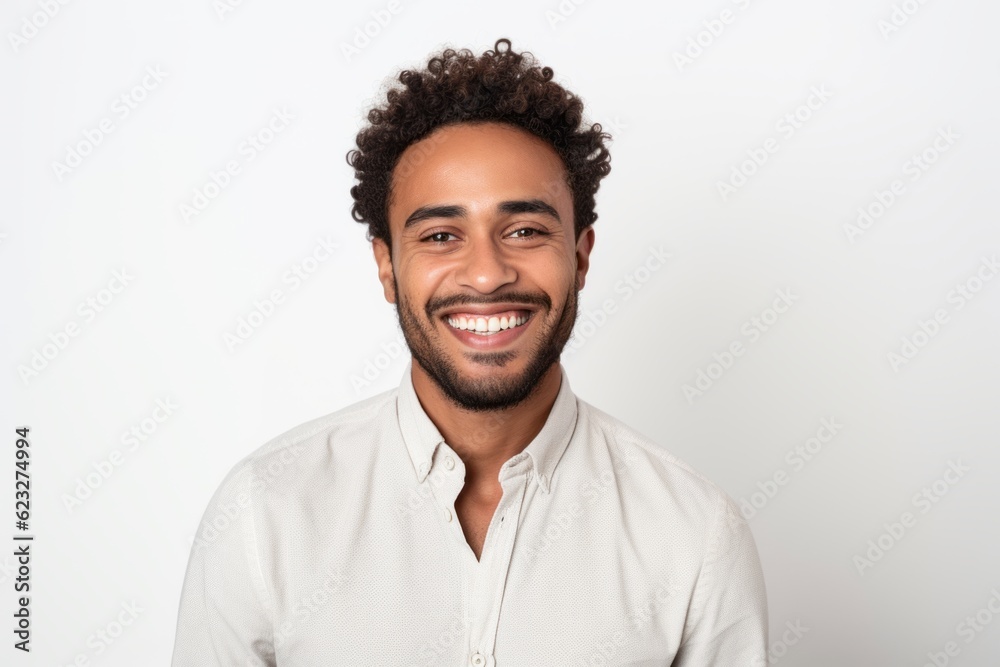 Portrait of a smiling young african american man against white background Portrait of a smiling young african american man against white background