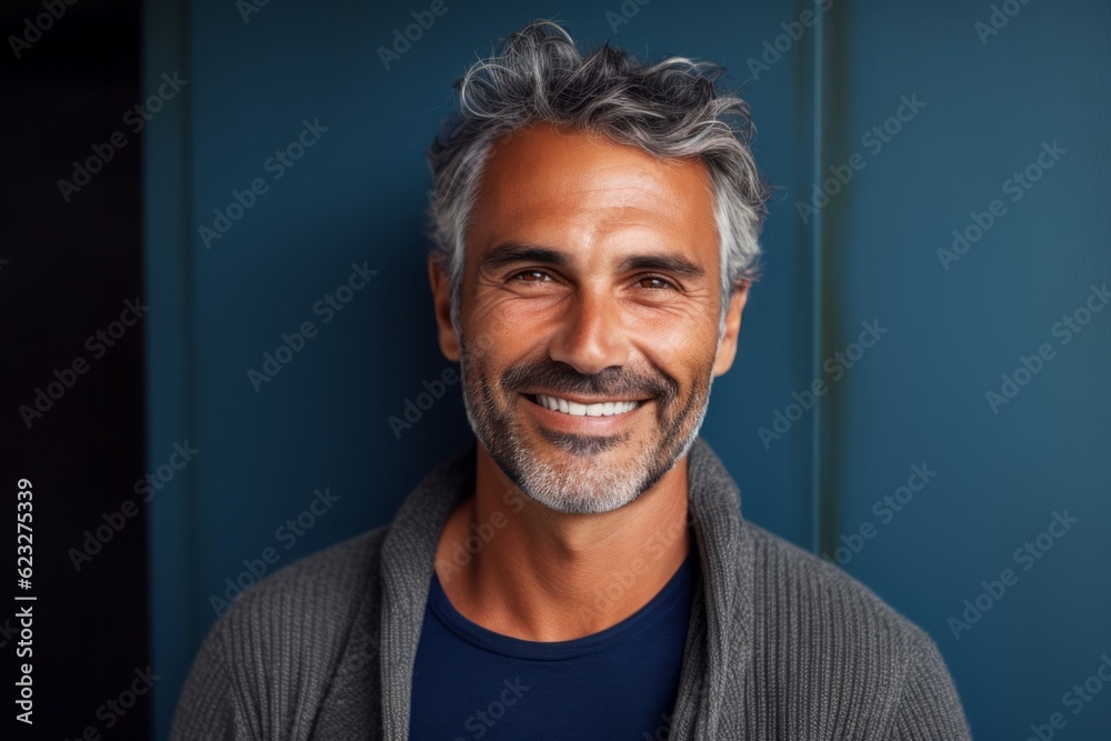 Obraz premium Portrait of a handsome middle-aged man smiling at the camera