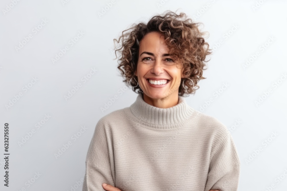 Medium shot portrait photography of a pleased Brazilian woman in her 40s wearing a cozy sweater against a white background Medium shot portrait photography of a pleased Brazilian woman in her 40s wearing a cozy sweater against a white background