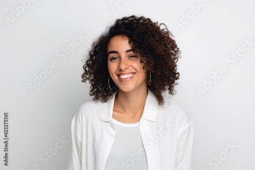 Portrait of a beautiful young woman with curly hair on white background