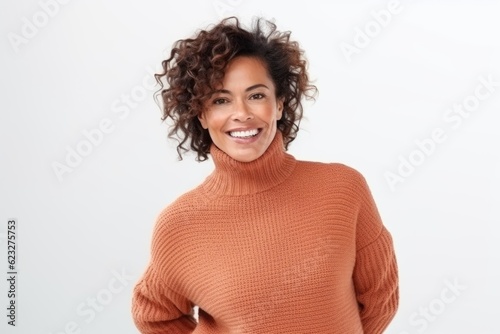 Portrait of a happy african american woman smiling at camera isolated over white background