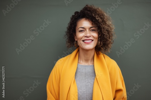 Portrait of a smiling african american woman in yellow coat