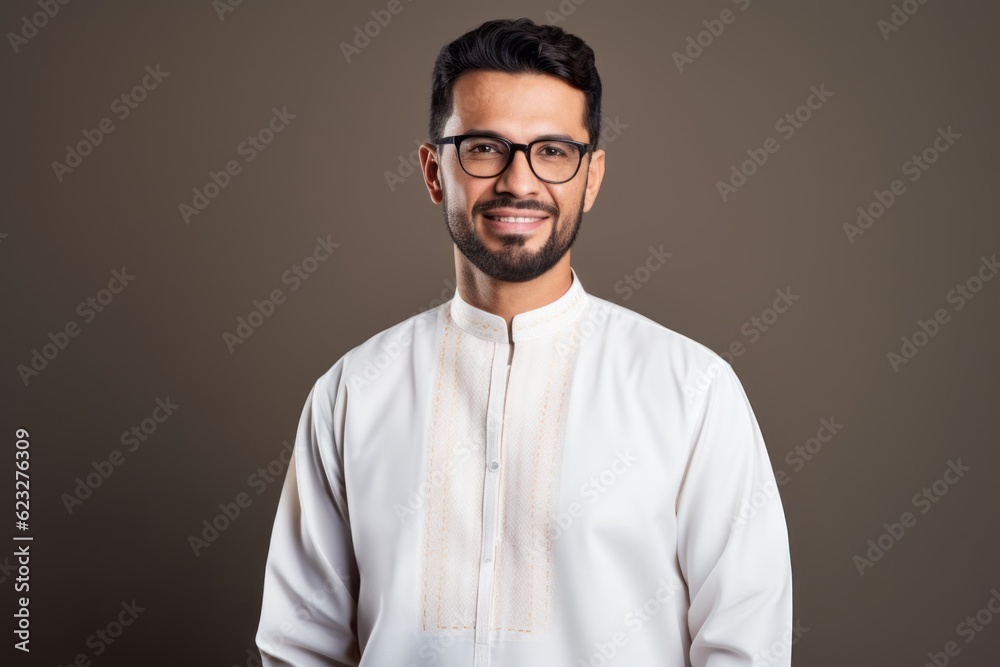 Portrait of a handsome Indian man wearing eyeglasses and looking at camera Portrait of a handsome Indian man wearing eyeglasses and looking at camera