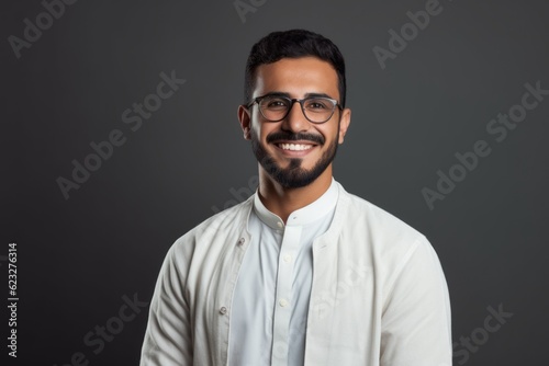 Portrait of a smiling indian young man in eyeglasses