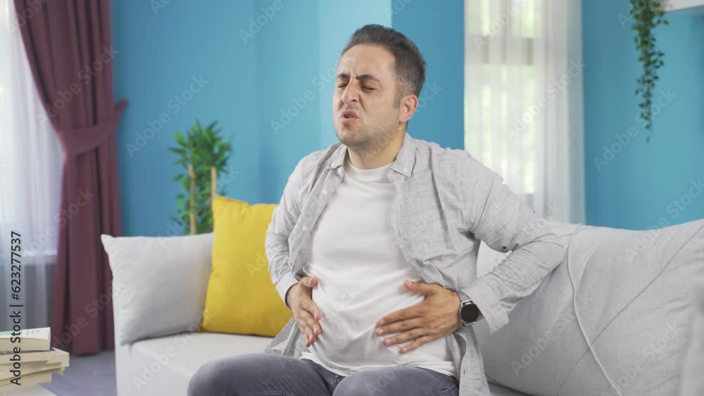 Man experiencing stomachache. Man experiencing stomachache.