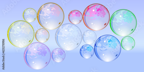 Glass transparent multicolored balls on a purple background.