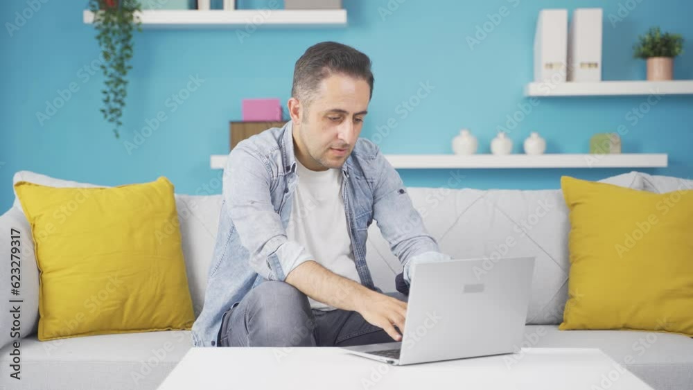 Man looking at laptop gets frustrated. Man looking at laptop gets frustrated.