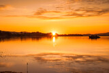 Orange hues - sunrise over the water