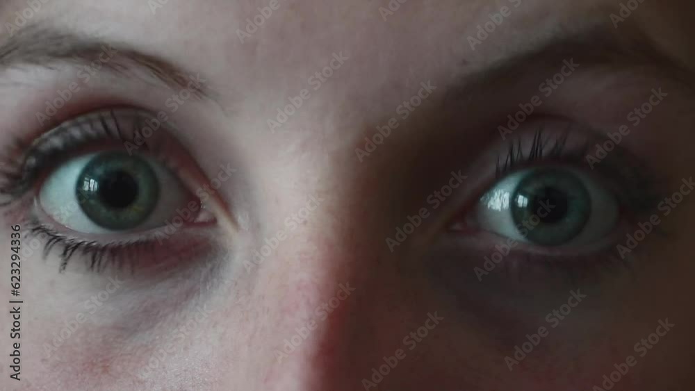 Caucasian young woman opening the eyes Caucasian young woman opening the eyes