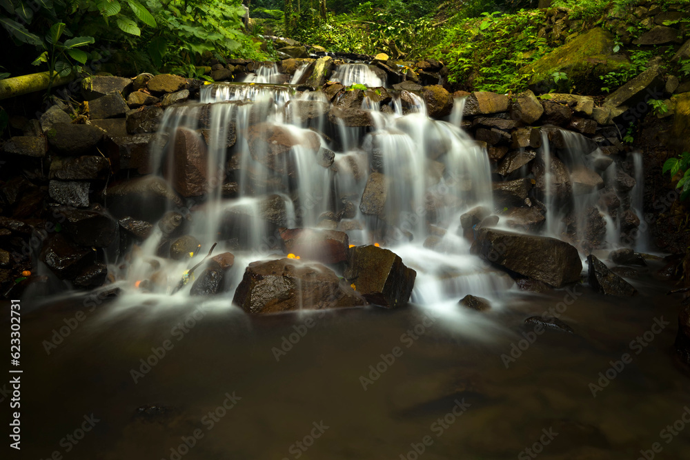 Obraz premium Landscape of multilevel waterfalls in Dlundung, Trawas, Mojokerto. Indonesia.