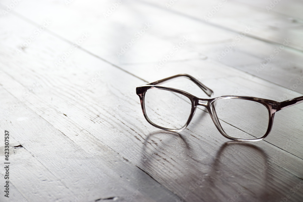 Reading spectacles on a wooden table Reading spectacles on a wooden table