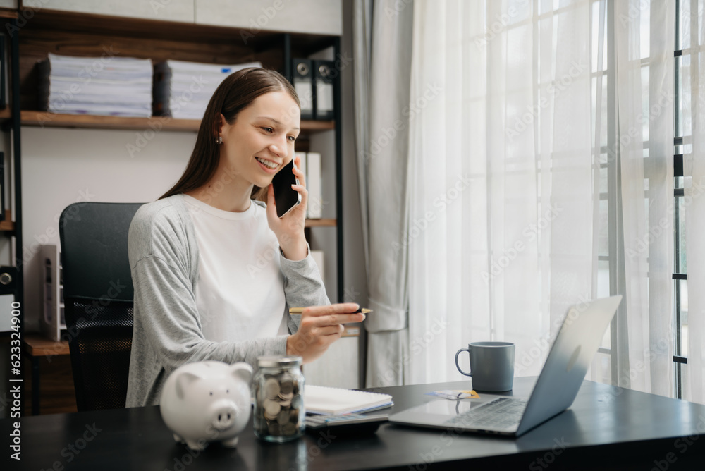Woman freelancer is working her job on computer tablet and laptop Doing accounting analysis report real estate investment data, Financial at office. Woman freelancer is working her job on computer tablet and laptop Doing accounting analysis report real estate investment data, Financial at office.