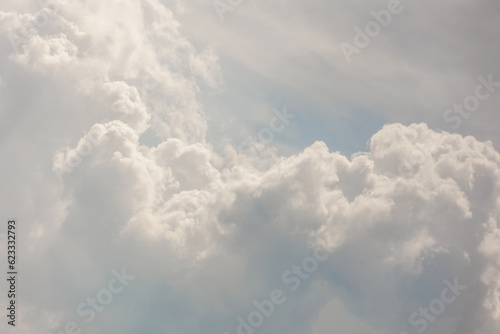 Fototapeta Naklejka Na Ścianę i Meble -  white storm clouds in sky background of nature. weather and climatic conditions, ecology. view of clouds from airplane window. Flight and freedom are religion. The top of sky and atmosphere, solar