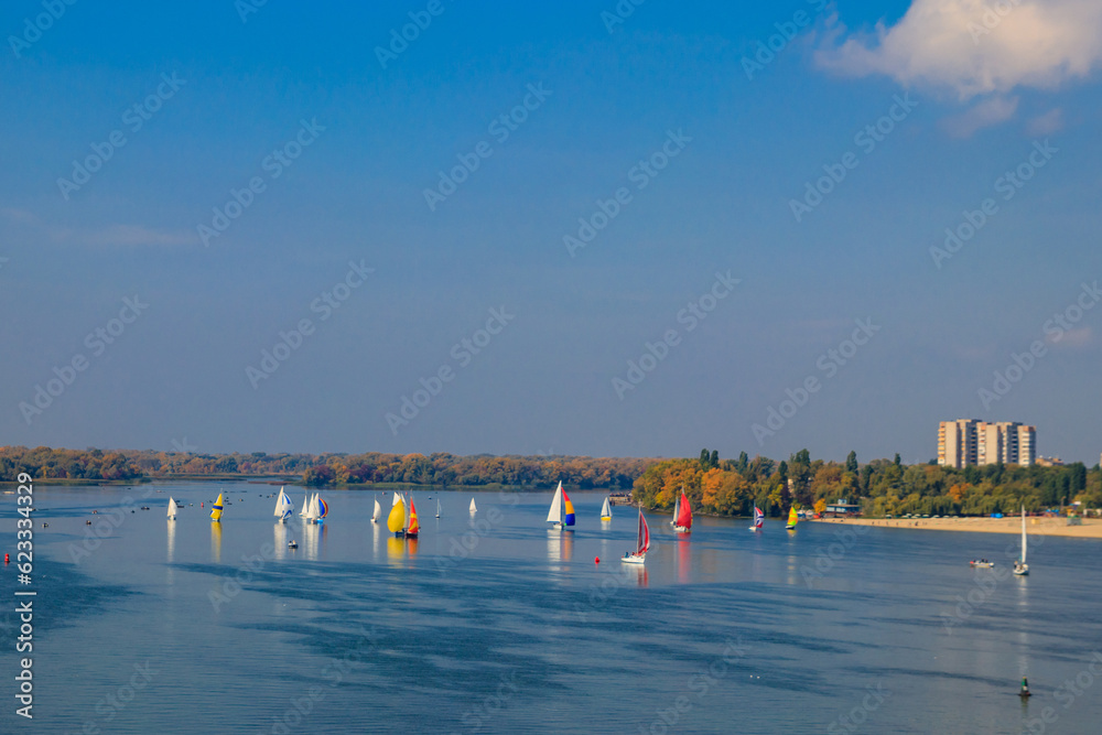 Yachts at sailing regatta on the Dnieper river in Kremenchug, Ukraine