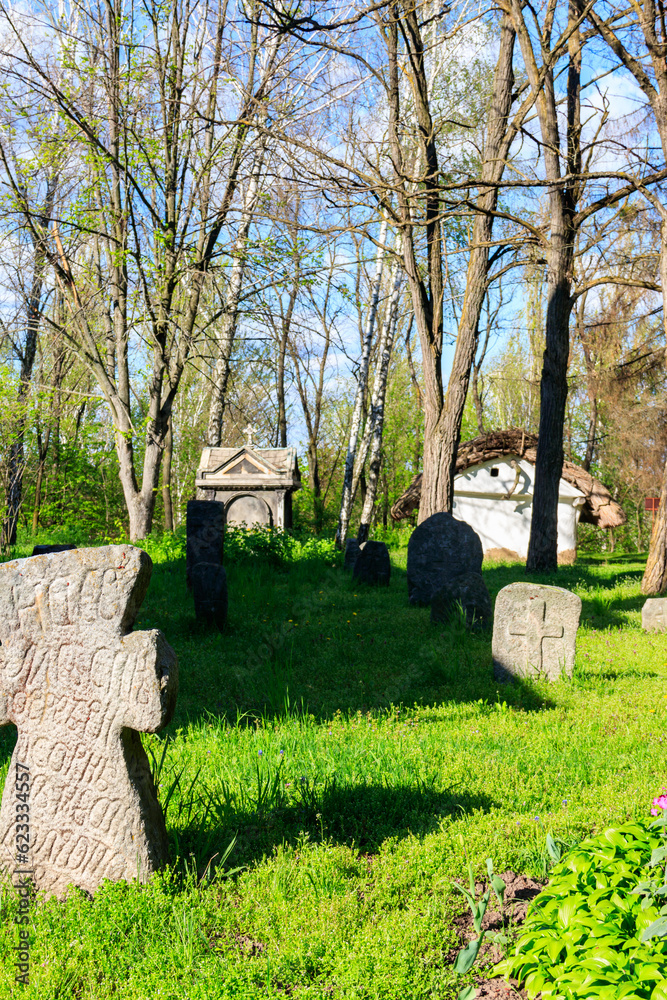 Naklejka premium Old stone gravestones in the old abandoned cemetery