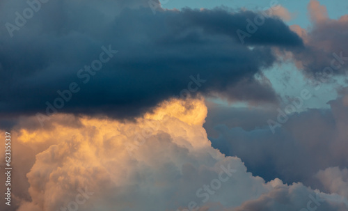 Rain clouds at sunset as background