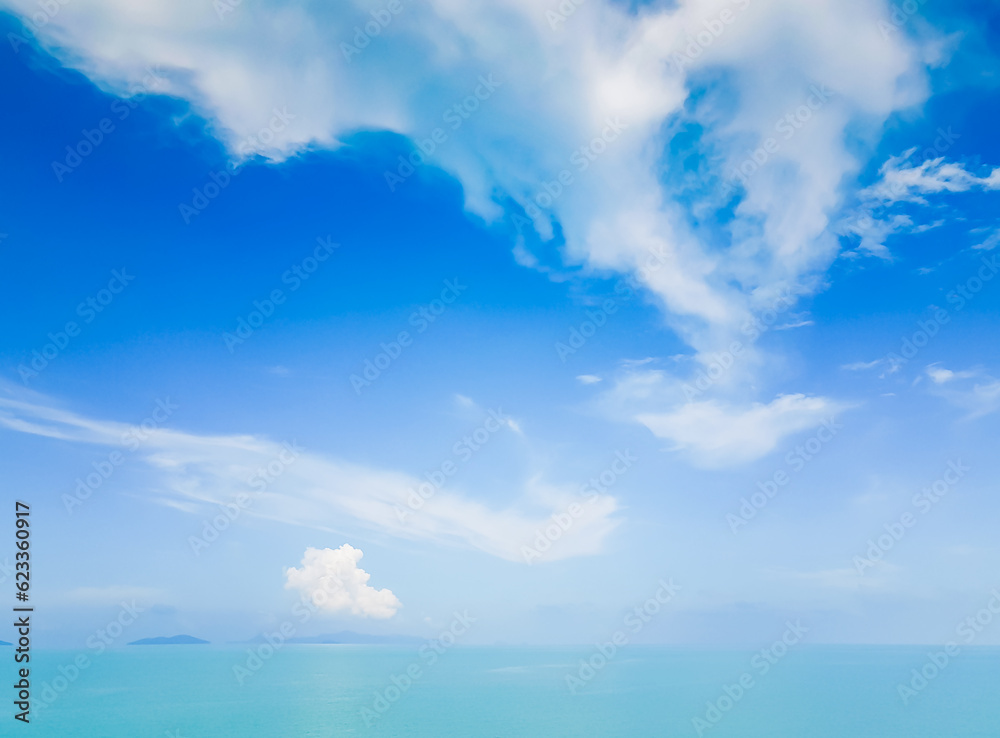 Blue sky with white cloud over turquise sea, scenic tropical seascape.
