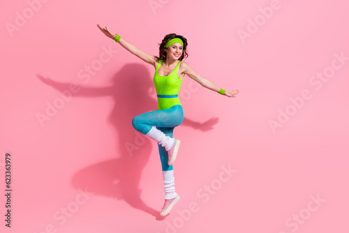 Fototapeta Naklejka Na Ścianę i Meble -  Photo of sportive lady trainer jump up practice pilates gymnastics isolated over pastel color background