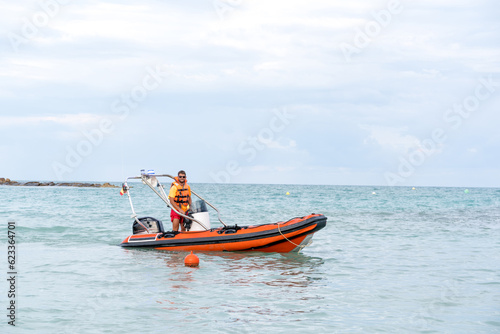 Lifeguard on a boat in the middle of the sea
