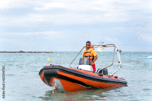 Lifeguard driving a boat in the middle of the sea