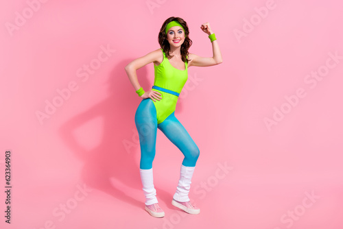 Photo of power coach sporty lady have sport routine show triceps muscular body isolated over pastel color background