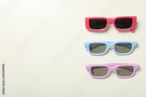 Colorful sunglasses on white background, space for text