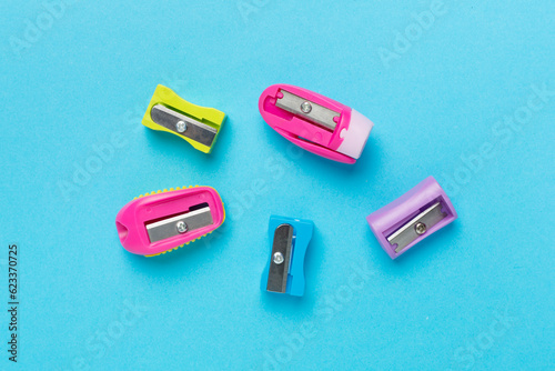 Different sharpeners on color backgroung, top view