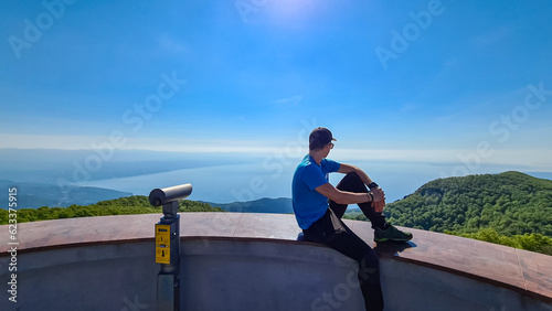 Photos A man sitting on top of Vojak and enjoying the panoramic view on Mediterranean Sea