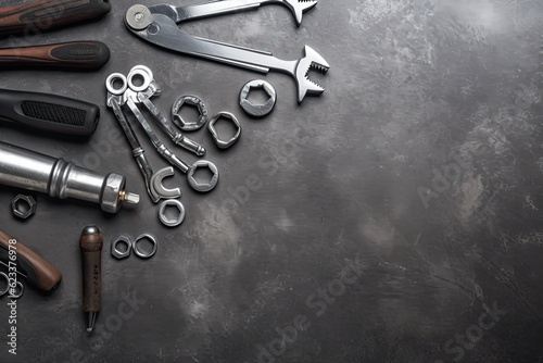 Fotografija Auto mechanic's tools on grey stone table with copy space
